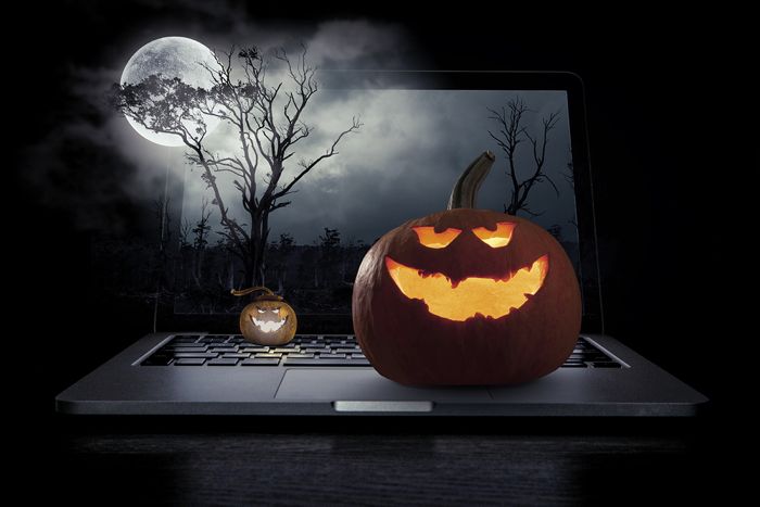 Halloween images over laptop